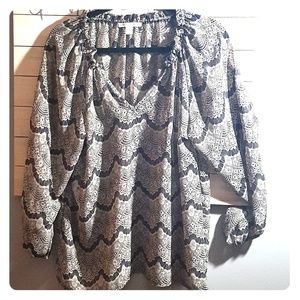 Classy black and ivory lace pattern blouse.